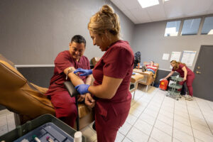 Student phlebotomists in lab at Pinnacle Tech College